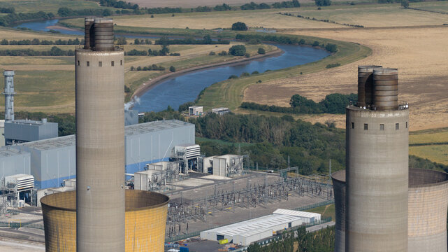 Aerial view of West Burton Power Station with its prominent cooling towers and industrial infrastructure situated near the River Trent in Retford, England, United Kingdom.