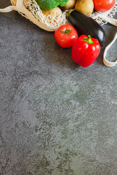 Fresh vegetables arranged beautifully on a textured surface create a vibrant culinary scene
