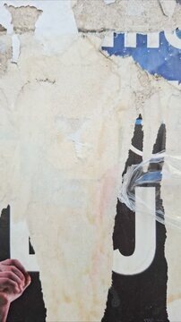 Time-lapse of an old torn and ripped street poster background, messy and weathered paper art collage