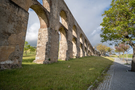 Aqueduct Arches in Elvas Portugal with Green Grass and Trees