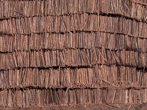 Aerial view of stacked logs arranged in rows at a timber yard in Gdansk, Poland.