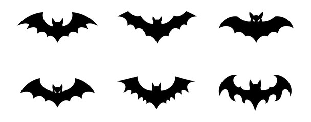 Fototapeta premium Collection of symmetrical flying bat shapes with glowing eyes for spooky party decoration