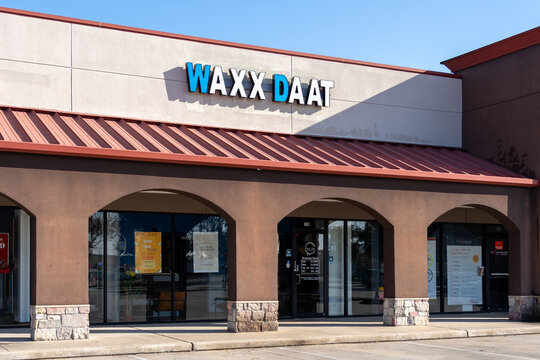 Pearland, TX, USA - March 10, 2022: The store front for Waxx Daat, a waxing and skincare salon located in Pearland, Texas, USA. 