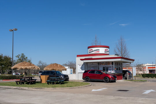Pearland, Texas, USA - March 10, 2022: AJ's Snowcones, a small drive in style shop located on Broadway Street in Pearland, Texas, USA. 
