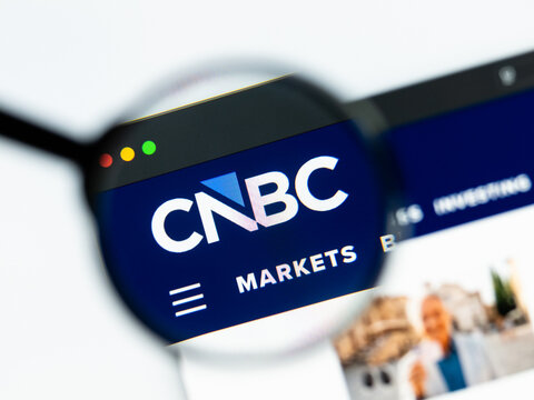 Milan, Italy 2026, 15 AGO Closeup of cnbc com website page on a laptop screen. Focus on cnbc com logo under a magnifying glass.