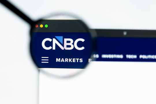 Milan, Italy 2026, 15 AGO Closeup of cnbc com website page on a laptop screen. Focus on cnbc com logo under a magnifying glass.