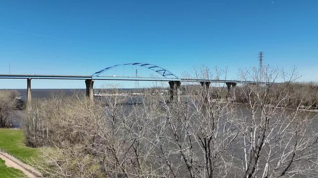 Rising Tree Aerial of leo frigo bridge in early spring over the fox river green bay wisconsin.