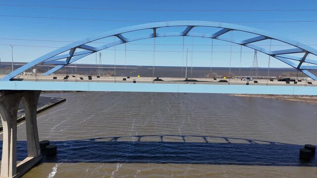 Left to Right Traffic Aerial of leo frigo bridge in early spring over the fox river green bay wisconsin.