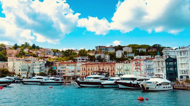 Stunning view of upscale Bebek district waterfront with luxury yachts anchored on Bosphorus in Istanbul, Turkey. Scenic coastal neighborhood near landmarks of ancient Ottoman Empire.