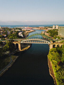 Sunderland UK: 17th July 2026: Sunderland River wear and city centre at dusk. Wearmouth Bridge and the Monkwearmouth Railway Bridge at sunset