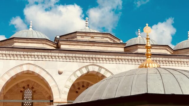 Beautiful panorama of Istanbul courtyard inside Beyazit Mosque built by Mimar Sinan in Turkey. Ancient Ottoman Empire architecture with traditional ritual washing ablution fountain and stone domes.