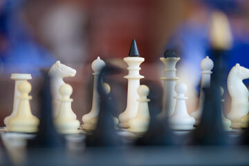 Close-up of chess pieces during a game with blurred background, symbolic image for planning, tactics, leadership and business strategy Photo © slexp880