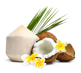 Fresh coconuts, plumeria flowers and green leaf isolated on white © New Africa