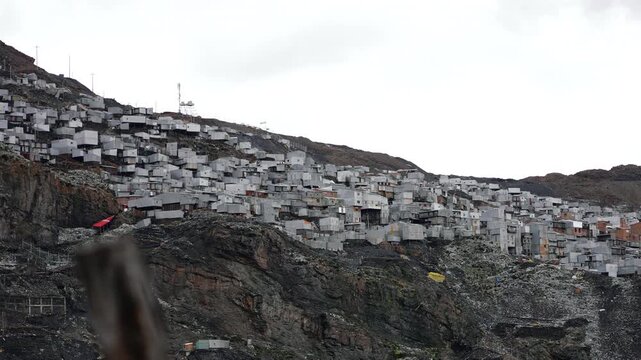 Dense Mining Settlement Built Across Rocky Mountain Slope