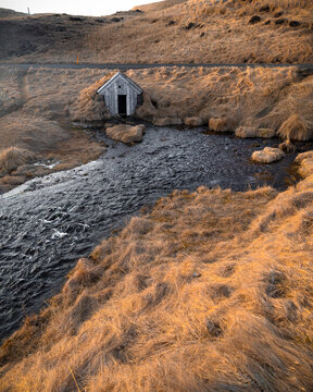 Title
Small Wooden Turf House by a Running Stream in Rural Icelandic Field