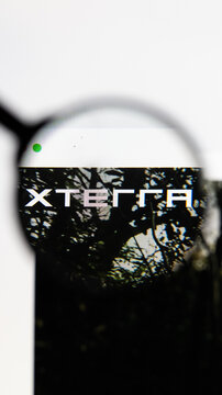 Milan, Italy 2026, 15 AGO Closeup of XTERRA Triathlon website page on a laptop screen. Focus on XTERRA Triathlon logo under a magnifying glass.