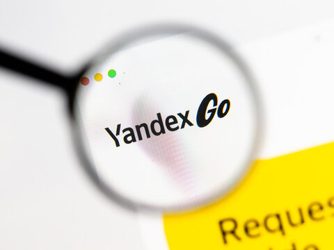 Milan, Italy 2026, 15 AGO Closeup of Yandex Go website page on a laptop screen. Focus on Yandex Go logo under a magnifying glass.