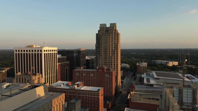 Aerial establishing shot of downtown Raleigh, North Carolina at sunset