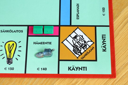 Monopoly board game. Fun for the whole family. Finnish text. Business and estate concept. Go to jail spot.