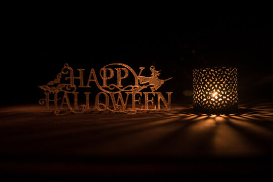 Halloween concept. Creepy silhouette in the dark corridor with pumpkin head. Toned light with fog on background.