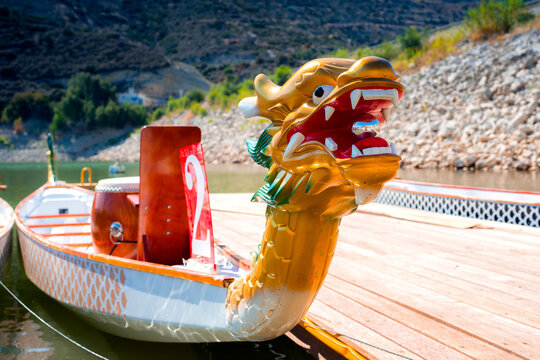 Close-up of sport dragon boat parked at the jetty on the lake