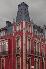 Historicist-style, late XIX c.Edificio Amelia Building, shocking-red painted with slate roof and truncated pyramidal dome. Luarca-Asturias-Spain-030 © rweisswald
