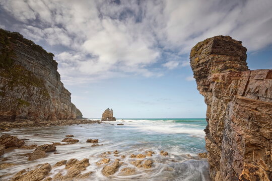 Playa de Portizuelo Beach and Piedra El &Oacute;leo Rock, struck by the rising tide waves on a springtime late afternoon. Barcia, Vald&eacute;s-Asturias-Spain-035