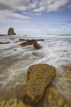 Playa de Portizuelo Beach and Piedra El &Oacute;leo Rock, pounded by the waves of the rising tide on a springtime sundown. Barcia, Vald&eacute;s-Asturias-Spain-037
