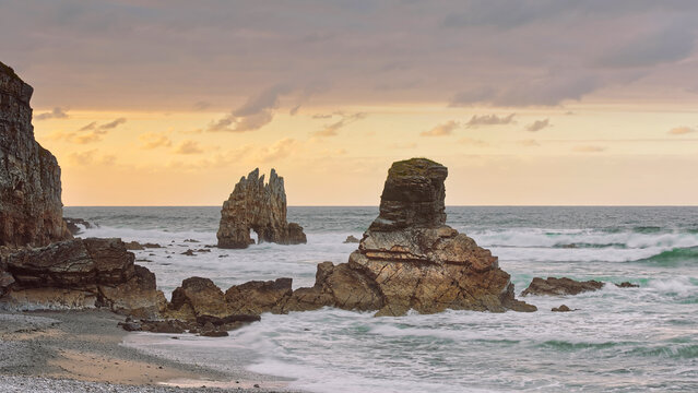 Playa Portizuelo Beach and Piedra El &Oacute;leo Rock, pounded by the rising tide waves on a blazing golden spring sunset. Barcia, Vald&eacute;s-Asturias-Spain-040