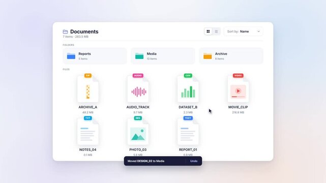 File manager window with cursor dragging a file into a folder and undo toast