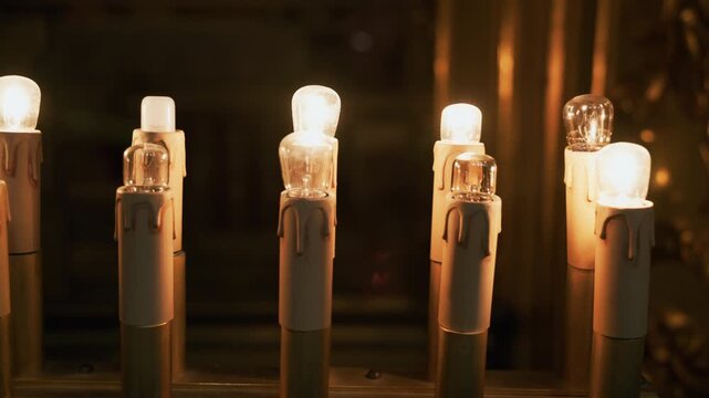 Electric votive candles in a typical Italian religious church