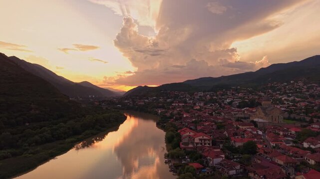 Aerial drone flight over Mtskheta at sunset, revealing Svetitskhoveli Cathedral and the Mtkvari River in Georgia&rsquo;s ancient Christian heartland.