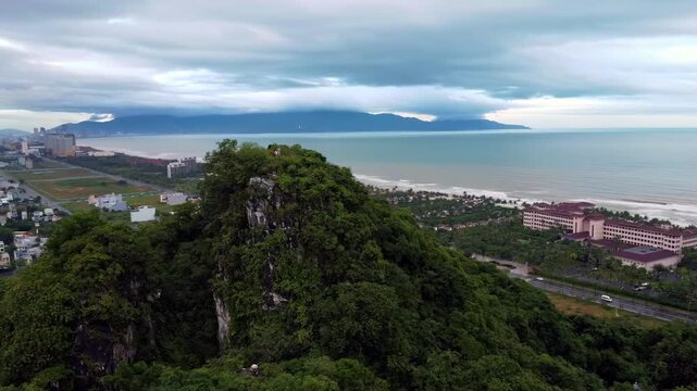 Marble Mountains at Dusk Above Non Nuoc Beach, Da Nang, Vietnam &ndash; Aerial View of Limestone Karst, Tropical Forest, Coastal Resorts and the South China Sea