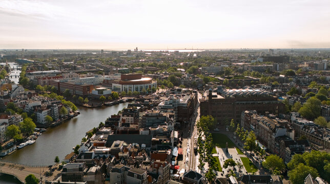 Drone view of Amsterdam city hall beside the Amstel River