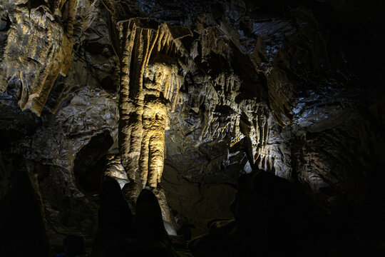 Illuminated stalactites and speleothem rock formations inside the subterranean chambers of the Lurgrotte cave in Peggau, Styria, Austria
