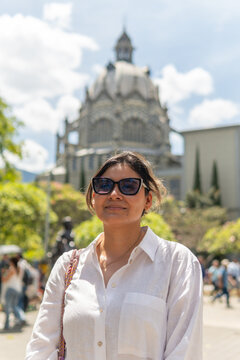 Woman traveling through botero plaza medellin colombia