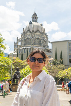 Woman traveling in botero plaza medellin colombia
