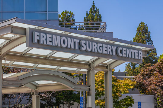 Healthcare facility entrance in Fremont California showing Fremont Surgery Center signage mounted on metal canopy under clear sky