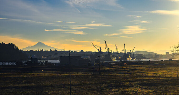 Mount Hood Above an Industrial Shipyard Waterfront at Golden Hour