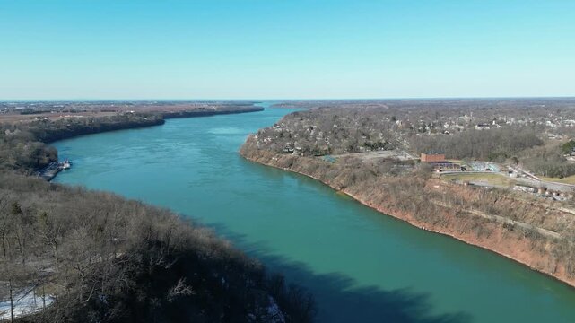 Aerial over the Niagara River to Lake Ontario during winter, March 2023. Border of the United States and Canada, Queenston, Ontario and Lewiston, New York. 