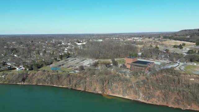 Aerial over the Niagara River to Lake Ontario during winter, March 2023. Border of the United States and Canada, with views of an outdoor event venue in Lewiston, New York. 