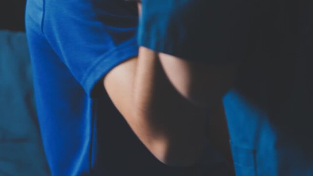 Doctor physiotherapist assisting a male patient while giving exercising treatment massaging the arm of patient in a physio room, rehabilitation physiotherapy concept