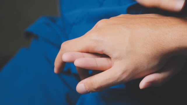 Doctor holding patient's hand on a white desk during medical consultation, offering support, empathy, care, reassurance, and compassion in a hospital or clinic setting