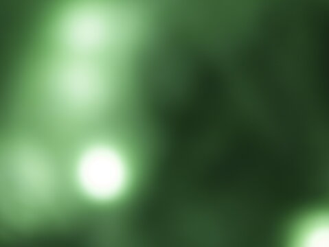 Una toma de cerca de un fondo abstracto de luces de navidad de color verde y blanco en la oscuridad. Desenfoque bokeh