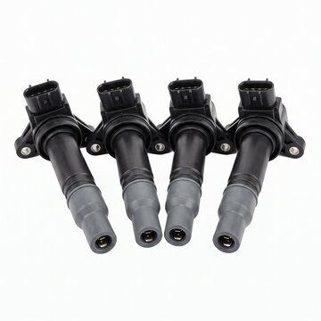 Four ignition coils for a car engine, showcasing precision engineering and automotive technology. 