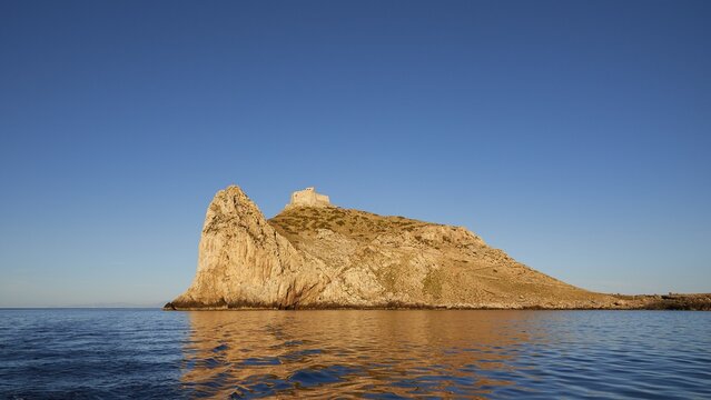 Evening light, Castello di Punta Troia, Boat tour, View from the sea, Bizarre rock formations, Rugged mountains, Marettimo, Egadi Islands, Sicily, Italy