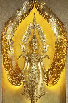 Symbolic depiction of the Buddha as an enlightened, radiant and regal figure in princely regalia, with a flame-shaped ornamental halo (aureole), at the Buddhist temple complex of Wat Phra That Sorn Kaew, Khao Kho Mountains, Phetchabun Province, Isan, Thailand