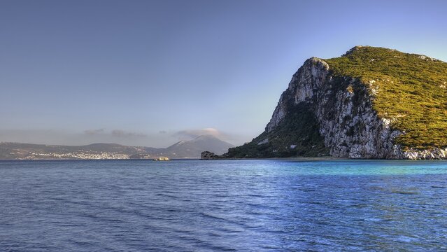 Coastline with big rocks and clear blue water, Navarino Bay, Pylos, Peloponnese, Greece