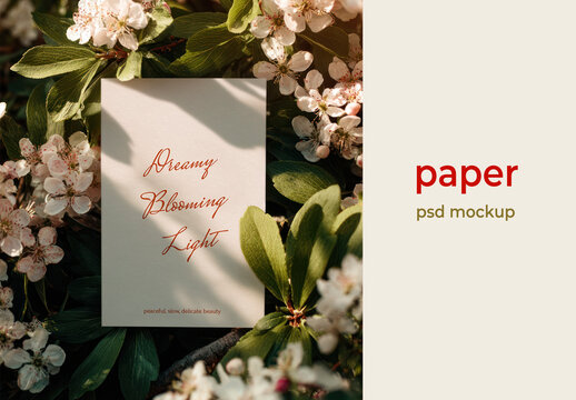 Elegant Paper PSD Mockup With Floral Arrangement And Soft Botanical Light