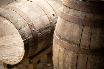 Rustic Wooden Barrels Resting Quietly In Warehouse © LightItUp